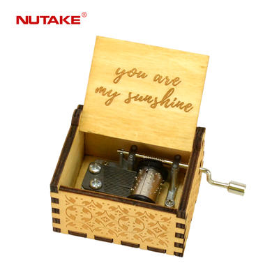 Hand cranked wooden music box that plays you are my sunshine 55805101-32,1